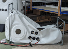 Newtowne shoe sit down portable hyperbaric chamber in factory setting