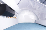 Interior of OxyAir OLV-YT01 hyperbaric chamber showing climate control unit, oxygen valves, and padded blue floor