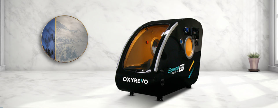 OXYREVO Space 60 black hard hyperbaric chamber on a white floor with a decorative wall in the background